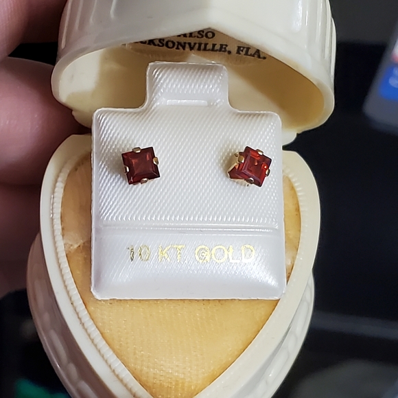 New 10k garnet stud earrings. Stamped 10k. Princess cut genuine garnets. Each on